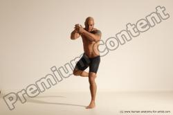 Underwear Gymnastic poses Man Black Muscular Bald Dancing Dynamic poses Academic